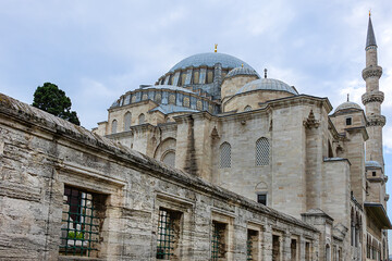 Naklejka premium Architectural fragments of famous Suleymaniye Mosque (from 1557) - Ottoman imperial mosque located on the Third Hill of Istanbul. Mosque is one of the best-known sights of Istanbul, Turkey.