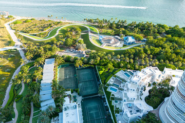 Exotic palm trees and coastline resort with tennis courts, sunny seascape for tourists relaxing