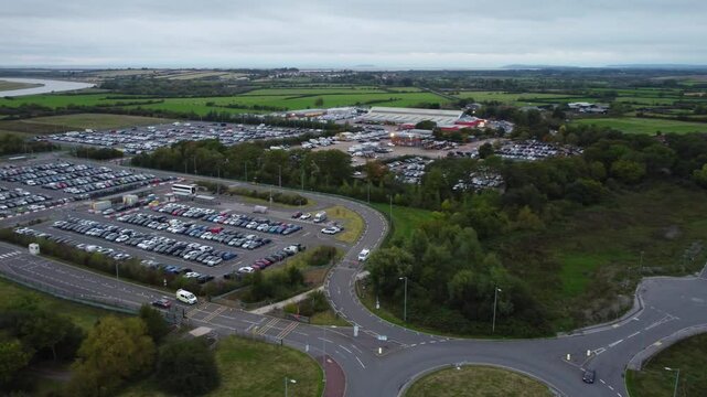 Aerial View of Dunball Bridgewater Industrial Estate Near Countryside and River, South west of England United Kingdom. Drone's Camera footage Was Captured During Cloudy Morning on October 2nd, 2024.