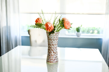 peach peonies in a mirrored mosaic beautiful vase