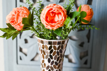 peach peonies in a mirrored mosaic beautiful vase