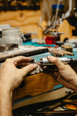 Jeweler Cleaning a Ring
