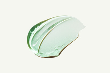 Aloe vera or centella asiatica smudge shaped gel green smudge isolated on gray.