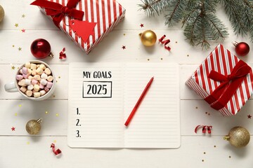 Notebook with blank to-do list for year 2025 and Christmas decorations on white wooden background,...