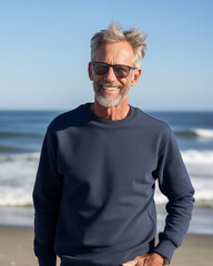 portrait of an older man grandpa grandfather senior male smiling on beach navy blue sweatshirt blank mockup mock-up fashion editorial photography