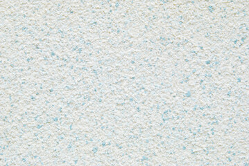 Light blue decorative flakes wall texture or pattern
