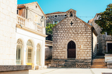 Church and main square of town of Omisalj, Krk island in Croatia