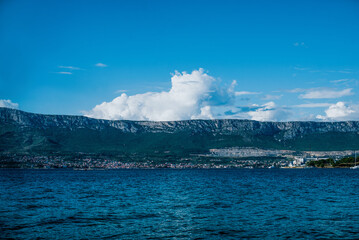 beautiful view, mountains, sea, white clouds, blue sky