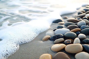 Close up of smooth beach pebbles being washed
