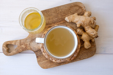Ginger tea in a mug on a white background