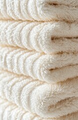 A macro macrophotograph of a brown cloth towel with color fibers folded in a closeup