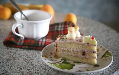 piece of tasty vanilla cake with coffee on the table