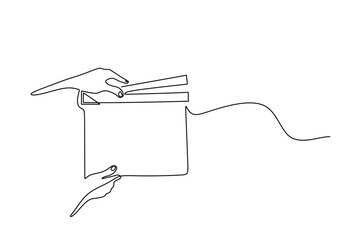 Hand holding film clapper in one line drawing. Entertainment object concept.