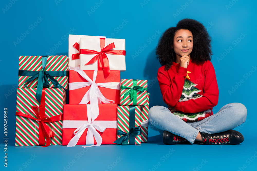 Poster Full length photo of young lady pile gifts look empty space dressed red christmas garment celebrate winter holidays on blue background