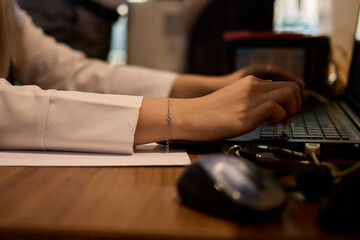 A Close Up View of a Hand Actively Using a Computer Mouse in a Professional Office Setting