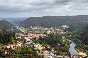 Obraz premium Stunning view over the village of Penacova in Portugal on a cloudy day in autumn.