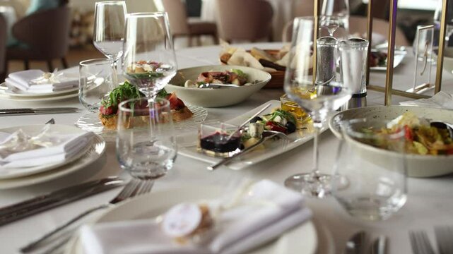 food and snacks on the wedding table with decor in the restaurant