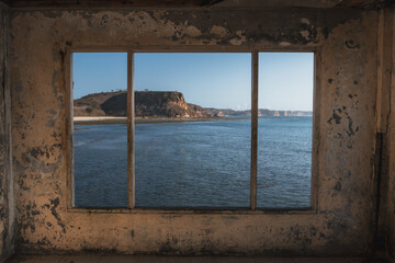 A look through an old window out to see from an abandoned house.