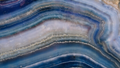 Blue and white agate stone with layers, highlighting its intricate patterns and texture