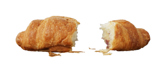 split croissant bread with crumbs isolated