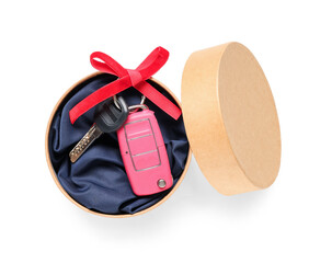 Gift box with keys of new car on white background
