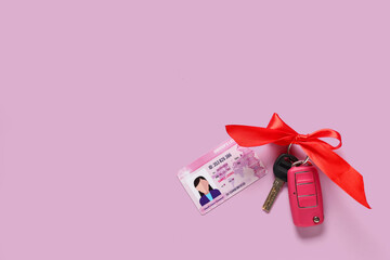 Gift keys of new car with bow and driving license on lilac background
