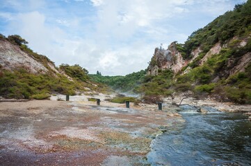 Volcanic landscape with geothermal pools and lush vegitation at War-O-Tapu Rotorua New Zealand 