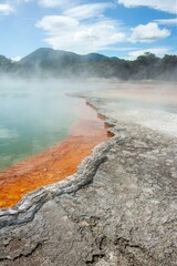 Wai-o-Tapu Rotorua New Zealand Multicoloured rocks reveal themselves beneath the water at Champagne Pool