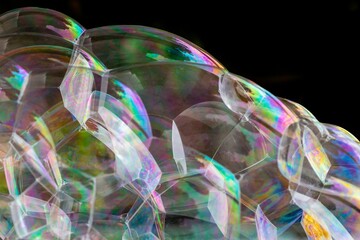 Close-up of bubbles foaming. multicoloured surfaces reflecting the light