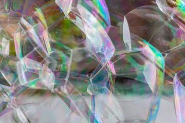 Close-up of bubbles foaming. multicoloured surfaces reflecting the light