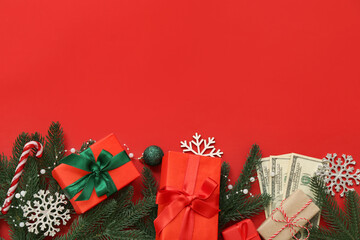 Composition with Christmas gifts, money and decorations on red background