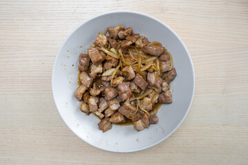 A plate of pork stir fry.