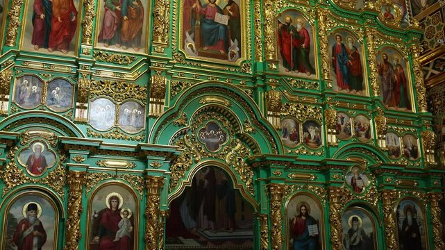 the interior of the Orthodox church with icons and paintings
