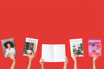 Female hands with different magazines on red background
