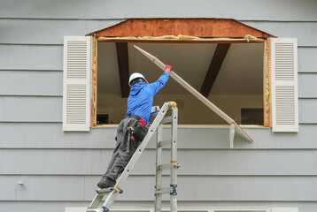 contractor working on replacing the window of the house © nd700