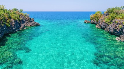 Fototapeta premium Crystal Clear Turquoise Water Between Rocky Cliffs on Tropical Island
