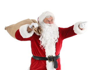 Santa Claus with bag pointing at something on white background