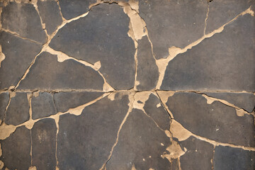 Rust-stained and peeling wall texture with weathered, cracked surface