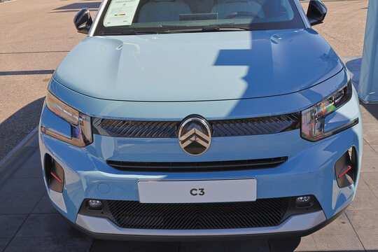Brand new blue novo citroen c3 is parked on a city side street