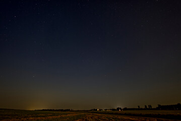 Sky full of stars over farm land