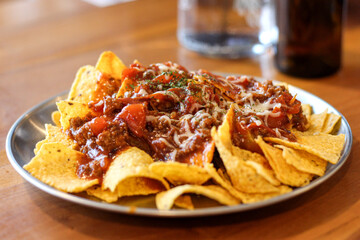 Spicy beef nachos in a cafe or restaurant.