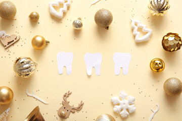 Composition with paper teeth, floss toothpicks and beautiful Christmas decorations on color background