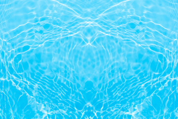 Blue water with ripples on the surface. Defocus blurred transparent blue colored clear calm water surface texture with splashes and bubbles. Water waves with shining pattern texture background.