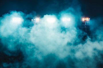 Fototapeta premium Bright stadium arena lights and smoke at night time