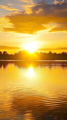 A serene sunrise over a calm lake, with golden sunlight reflecting on the water's surface