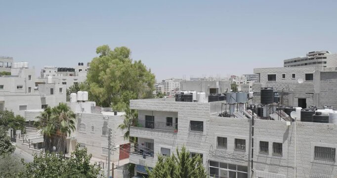 Cityscape in the Foreground and Newer Colonies in the Background with White Stone Classic Architecture