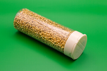 Pile of dried coriander seeds. A Close-up background texture of dried coriander seeds
