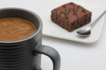 hot chocolate in a cup and chocolate cake