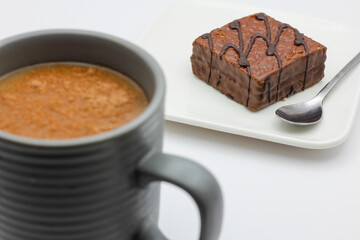 hot chocolate in a cup and chocolate cake