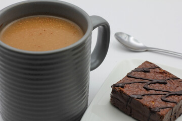 hot chocolate in a cup and chocolate cake